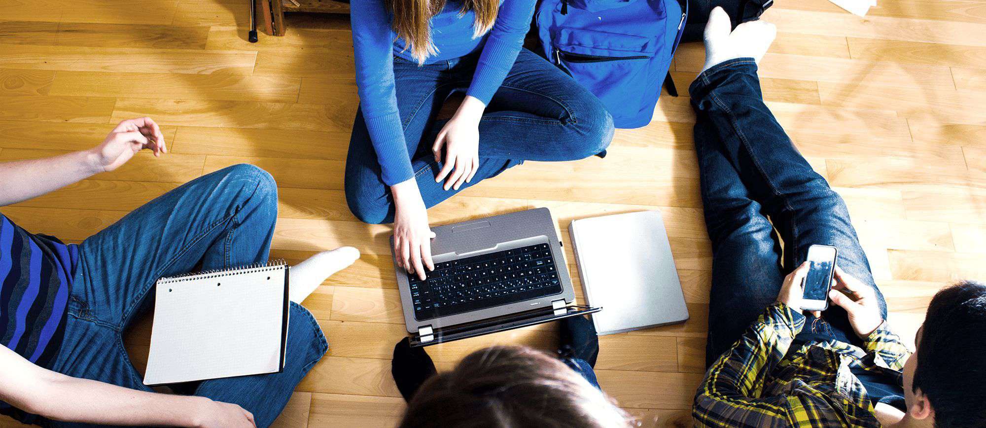 Young student working with teacher on electronic project